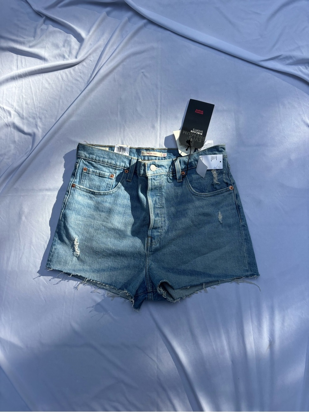 Levi's Light Blue High-Rise Distressed Jean Shorts